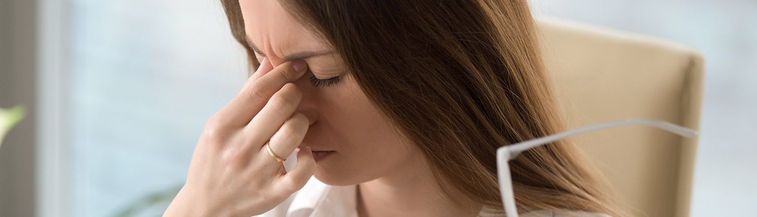 a woman experiencing dry eyes