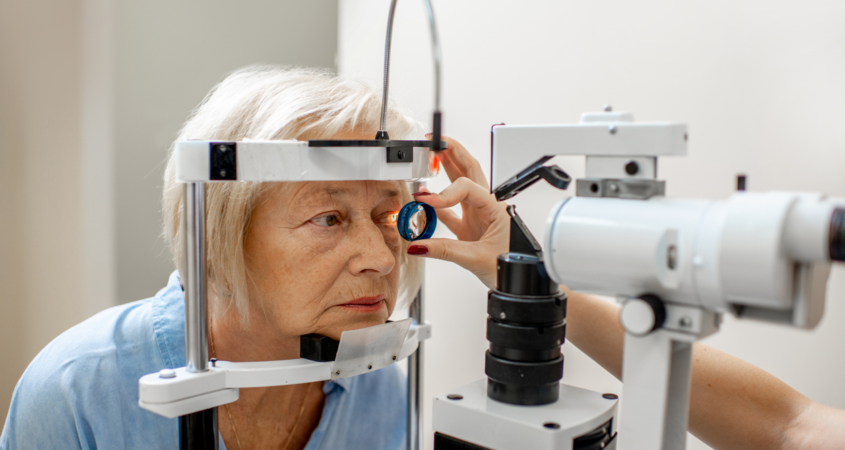 Senior woman during a medical eye examination with microscope in the ophthalmologic office